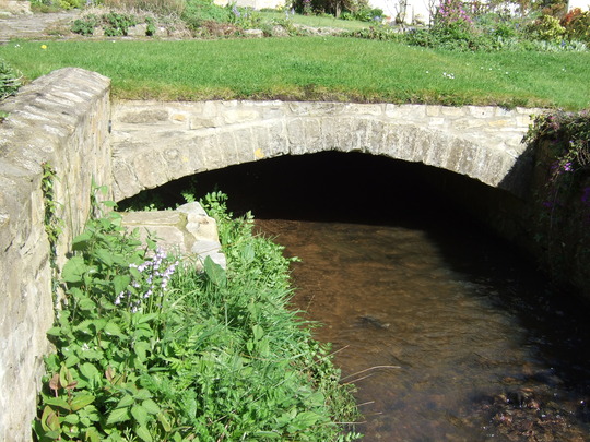 The far end of the bridge.