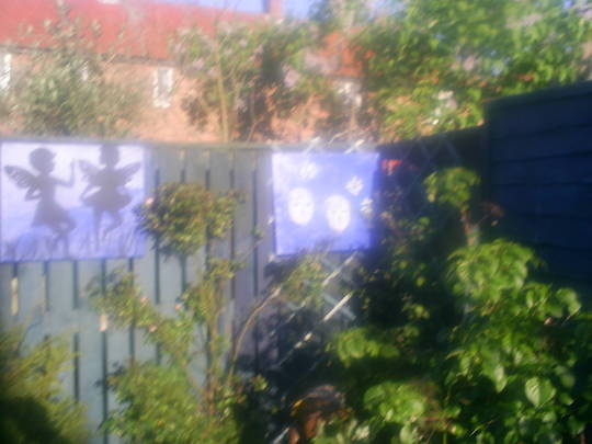 lucys work of art on garden fence
