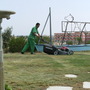 Hotel Gardener Mowing